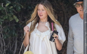 Jennifer Lawrence mặc váy ngủ, để mặt mộc nhợt nhạt đến trường quay