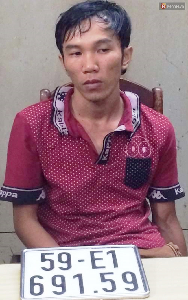 TP. HCM: Nam thanh niên chạy xe máy cũ vào bãi rồi tráo biển số sang xe tay ga, dắt ra ngoài - Ảnh 1.