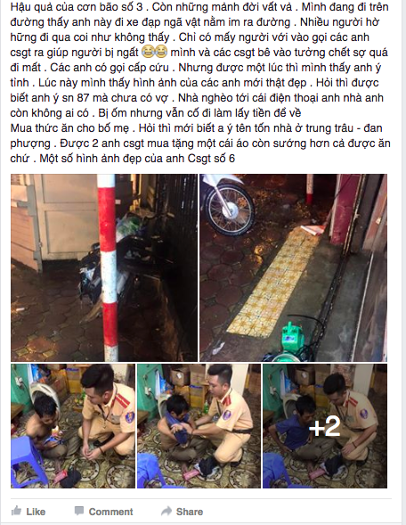 Hình ảnh đẹp của anh CSGT và chàng trai nghèo bị ngất trong mưa bão tối nay ở Hà Nội - Ảnh 1.