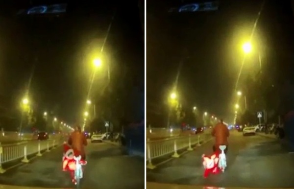 Trung Quốc: Bé gái suýt mất mạng sau khi ngã lăn quay từ yên xe đạp điện xuống đường - Ảnh 2.