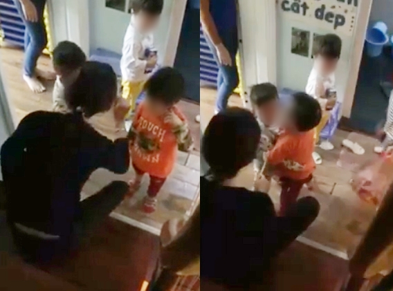 Sau vụ nhiều bé bị cô dùng dép đánh vào đầu, xuất hiện thêm clip cô giáo quát nạt, dí roi vào mặt trẻ - Ảnh 1.