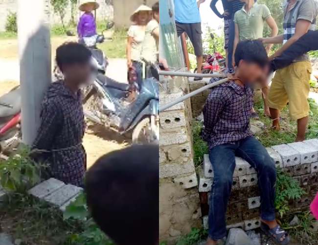 X&ocirc;n xao clip nam thanh ni&ecirc;n trộm g&agrave; bị người d&acirc;n d&ugrave;ng k&igrave;m kẹp cổ, tr&oacute;i v&agrave;o cột điện - Ảnh 1.