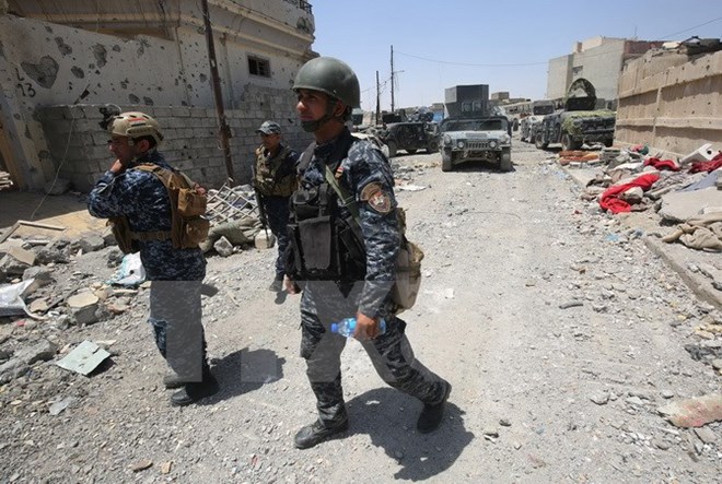 Lực lượng Iraq chiếm được Vương quốc Hồi giáo của IS ở Mosul - Ảnh 1.