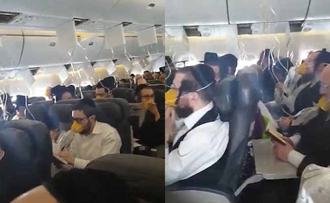 Máy bay gặp sự cố khẩn cấp, hành khách cùng đeo mặt nạ, đọc kinh và nắm tay cầu nguyện - Ảnh 2.