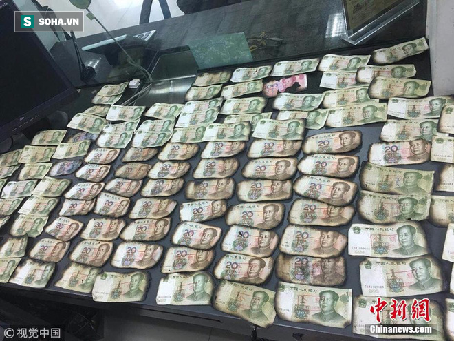 Đốt than sưởi ấm, cụ &ocirc;ng v&ocirc; t&igrave;nh đốt ch&aacute;y gần 40 triệu đồng tiền mặt - Ảnh 1.