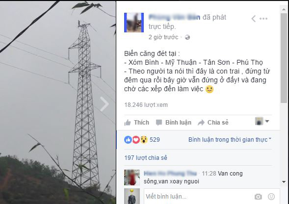 Phú Thọ: Một người đàn ông đang đứng trên đỉnh cột điện cao thế suốt nhiều giờ liền - Ảnh 1.