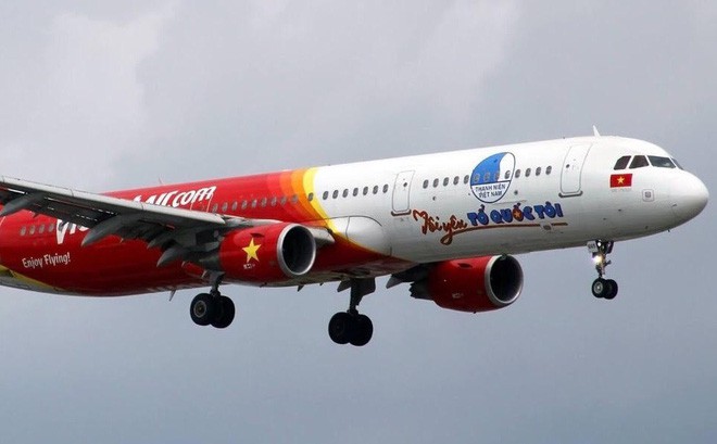  Chuyên cơ Tôi yêu Tổ quốc tôi của Vietjet đón đội tuyển U23 Việt Nam về nước - Ảnh 1.