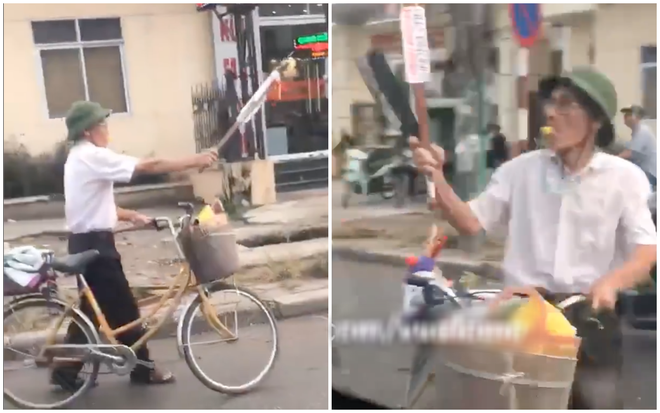 Clip: Cụ &ocirc;ng cầm gậy v&agrave; dao phay đồng thời thổi c&ograve;i inh ỏi để sang đường cho chắc - Ảnh 2.