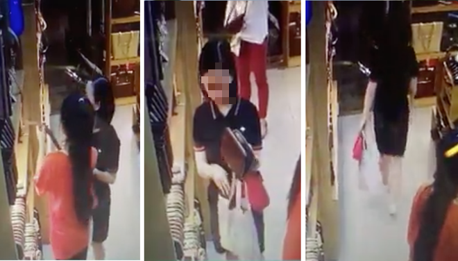Clip: Nữ quái ung dung lựa đồ hiệu rồi hack luôn 2 ví 1 thắt lưng đắt tiền mà nhân viên không hề hay biết - Ảnh 2. Clip: Nữ quái ung dung lựa đồ hiệu rồi hack luôn 2 ví 1 thắt lưng đắt tiền mà nhân viên không hề hay biết - Ảnh 2.