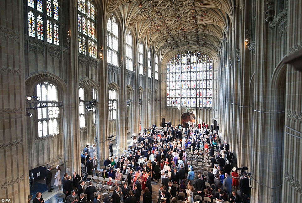 Church fills: Hollywood's finest mingle with English aristocracy as the ancient chapel of St George in the grounds of Windsor Castle slowly fills ahead of the midday wedding between Prince Harry and Meghan MarkleÂ Â 
