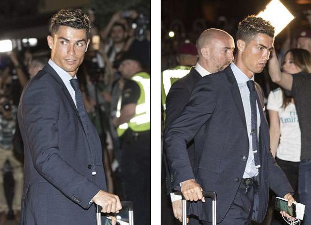 Ronaldo diện suit lịch lãm, đặt chân đến Kiev - Ảnh 3.