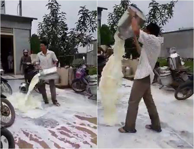 Clip xôn xao: Người đàn ông giận dữ đổ từng thùng sữa xuống đường trước sự chứng kiến của nhiều người - Ảnh 2.