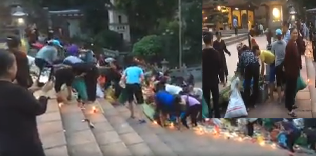 Xôn xao clip hàng trăm người dân mang túi nilon đổ xô vào hôi đồ cúng, cướp lộc ở chùa Hương - Ảnh 2.