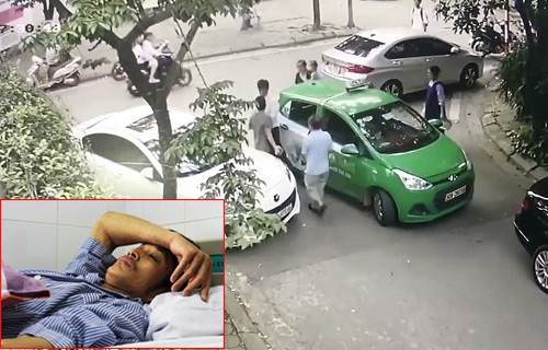 Khởi tố chủ xe Mercedes cầm gạch đập tài xế taxi phun máu tại Hà Nội - Ảnh 1.