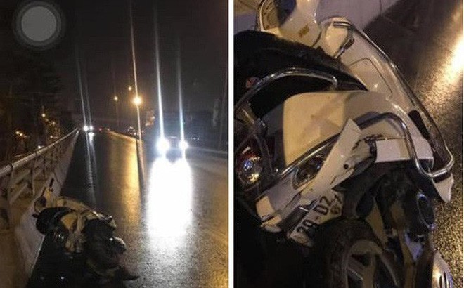 Truy tìm ô tô bỏ chạy sau khi đâm xe máy khiến 2 người tử vong trên đường phố Hà Nội - Ảnh 1.