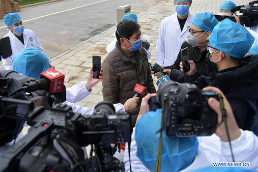 Trung Quốc: Bệnh nhân nhiễm virus corona đầu tiên xuất viện - Ảnh 6.
