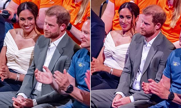 2 bức ảnh cho thấy Meghan đeo mặt nạ hoàn hảo trong khi Hoàng tử Harry mệt mỏi, chán chường - Ảnh 1.