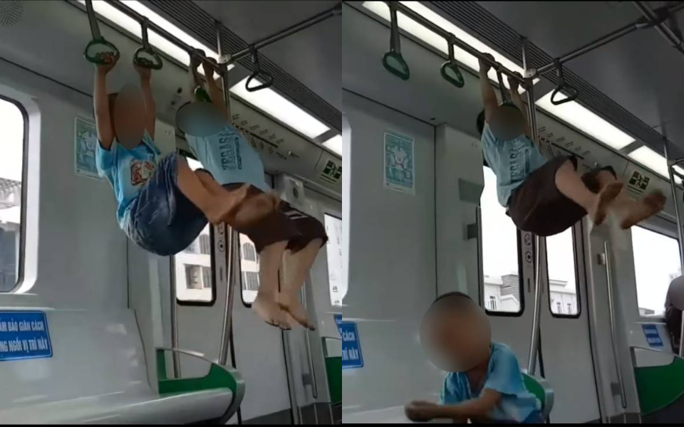Hai bé trai đánh đu trên tàu Cát Linh - Hà Đông, thái độ cổ vũ của người lớn đi cùng càng khiến nhiều người bức xúc - Ảnh 1. Hai bé trai đánh đu trên tàu Cát Linh - Hà Đông, thái độ cổ vũ của người lớn đi cùng càng khiến nhiều người bức xúc - Ảnh 1.