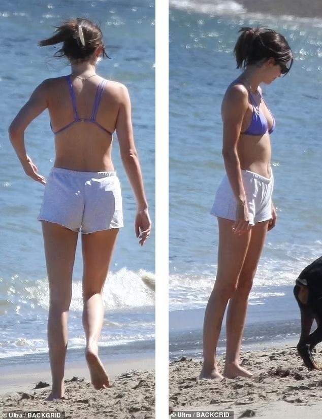 Siêu mẫu đắt giá nhất thế giới khoe eo thon, chân dài với bikini sexy trên bãi biển - Ảnh 4.