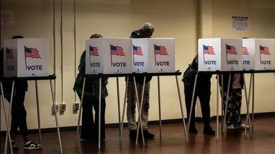 Voters cast their ballots during the first day of early voting at a polling station in Detroit, Michigan, on Saturday (October 19). (Bloomberg)