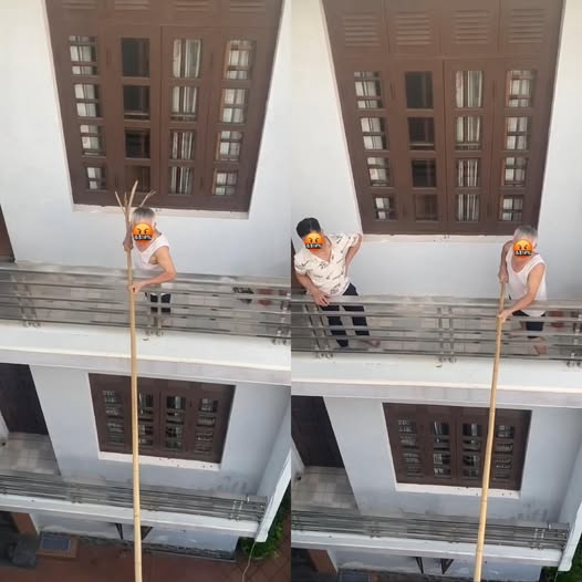 Người đàn ông dùng gậy dài ngăn hàng xóm mở cửa, khi biết nguyên nhân netizen lập tức "quay xe"- Ảnh 1.