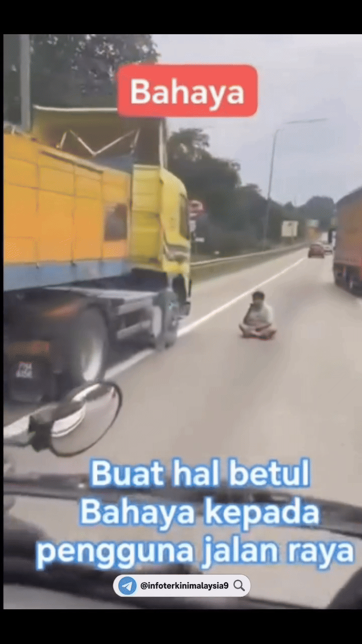 Tài xế xe tải dừng xe ở lề đường, ngồi khoanh chân làm 1 việc khiến ai đi qua cũng lắc đầu khó hiểu- Ảnh 2. Tài xế xe tải dừng xe ở lề đường, ngồi khoanh chân làm 1 việc khiến ai đi qua cũng lắc đầu khó hiểu- Ảnh 2.