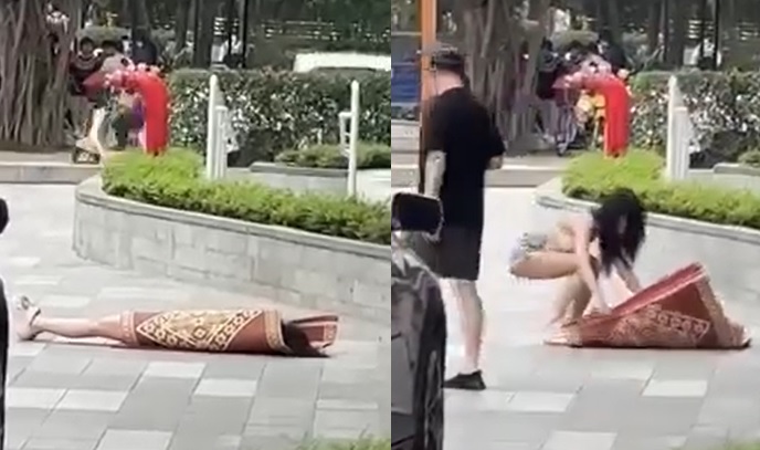 Clip hot girl c&oacute; h&agrave;nh động kh&oacute; hiểu, nằm đắp chiếu giữa sảnh chung cư đ&ocirc;ng người- Ảnh 1.