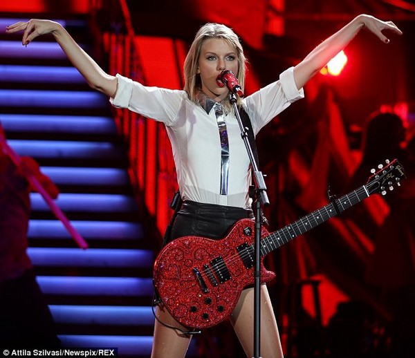 Taylor Swift shows off her long, shapely legs and plays the guitar 6