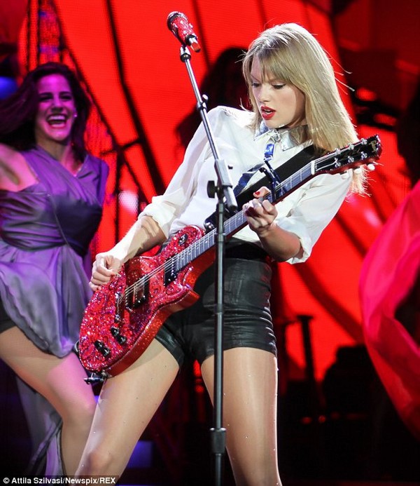 Taylor Swift shows off her long, shapely legs and plays the guitar 10