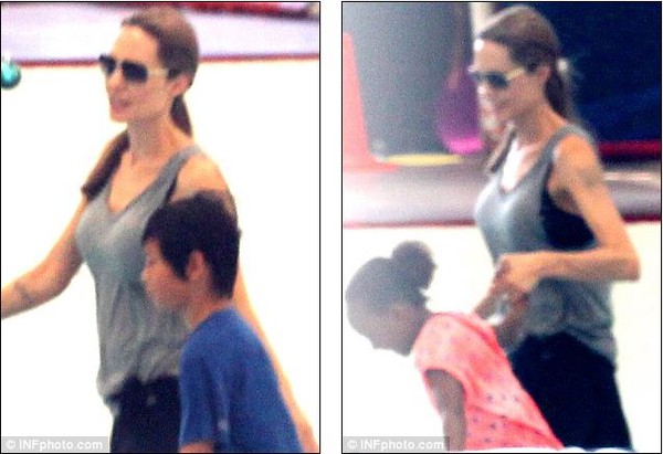 Angelina Jolie nắm tay Brad Pitt trượt băng tình tứ 3