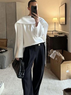 Tưởng mặc áo ngược ra đường ai ngờ lại là trend: Chiếc sơ mi giấu cúc đang "thống trị" tủ đồ công sở có gì mà hot đến thế?