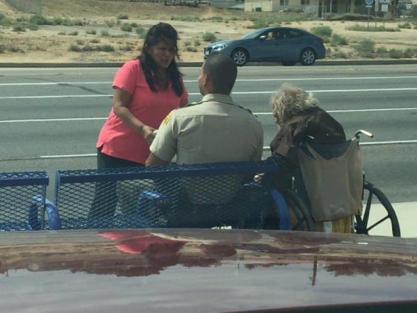 deputy-police-officer-assists-disabled-man_1-5dc29