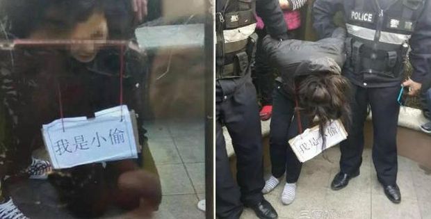 Trộm xe đạp điện, người phụ nữ Trung Quốc bị làm nhục bằng cách đeo tấm biển tôi là kẻ trộm - Ảnh 1.