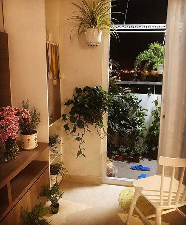 Nam Em sống trong căn hộ 60m2 ở TP. HCM, thiết kế đơn giản nhưng câu slogan ở phòng khách lại gây tranh cãi - Ảnh 6.