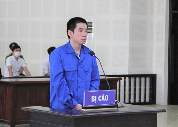 Bị nhắc nhở việc đỗ ô tô trước nhà, tài xế Grab đánh chết người - Ảnh 1.