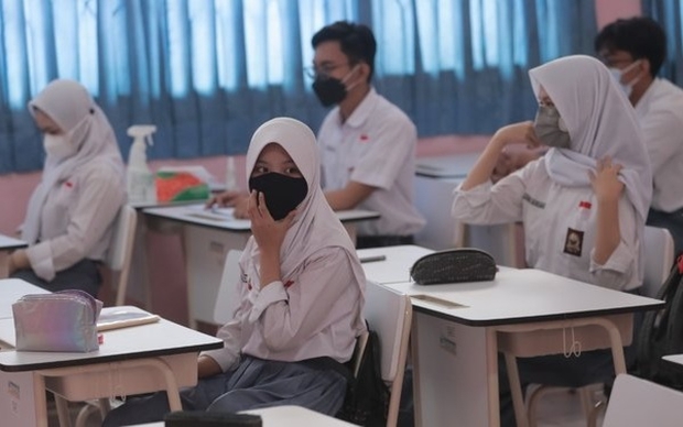 Hàng ngàn học sinh và giáo viên Indonesia mắc Covid-19 sau khi quay trở lại trường học - Ảnh 1. Hàng ngàn học sinh và giáo viên Indonesia mắc Covid-19 sau khi quay trở lại trường học - Ảnh 1.