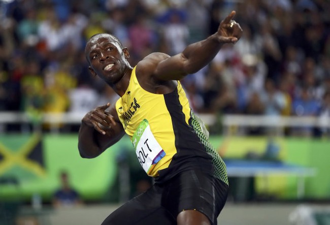 Giành huy chương vàng nội dung 200 m, Usain Bolt đi vào lịch sử Olympic - Ảnh 2.