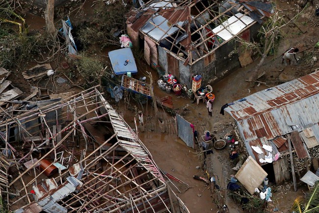 Những hình ảnh đau thương ở Haiti sau cơn bão mặt quỷ Matthew - Ảnh 7.