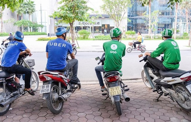 Grab mua lại Uber Đông Nam Á: Khách hàng được gì, tài xế Uber phải đăng ký như thế nào khi về một nhà với Grab? - Ảnh 1.