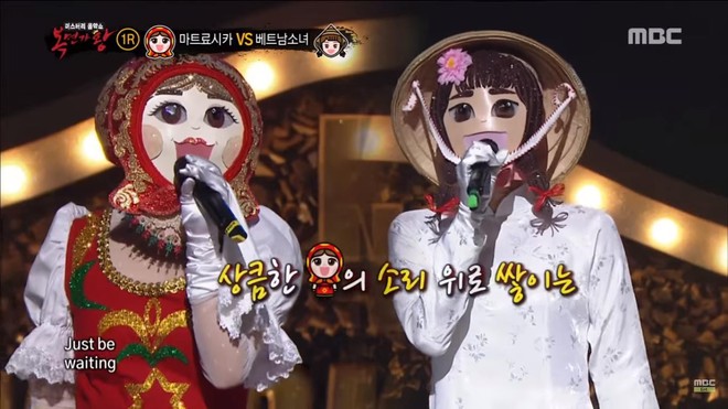 Tò mò danh tính cô gái mặc áo dài Việt Nam trên show hát giấu mặt Hàn Quốc - Ảnh 2.