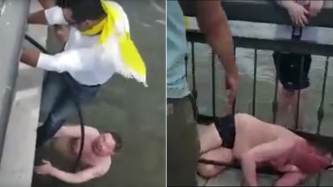 CĐV Colombia cứu người đàn ông Nga say rượu nhảy xuống nước - Ảnh 1.
