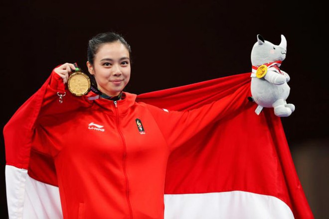 Nữ hoàng wushu Indonesia lên đỉnh ASIAD rồi tuyên bố giải nghệ - Ảnh 1.