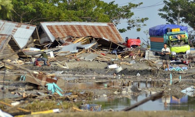 Hiện trường tan hoang sau trận động đất, sóng thần ở Indonesia - Ảnh 7.