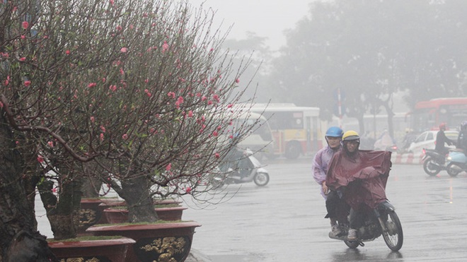 Không khí lạnh đã chính thức tràn về, miền Bắc chìm trong mưa rét, có nơi xuất hiện băng giá ngày mùng 1 Tết - Ảnh 1.