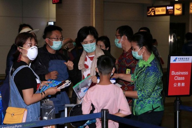 Về quê ăn Tết, hàng trăm ngàn người Trung Quốc mắc kẹt vì virus corona - Ảnh 1.