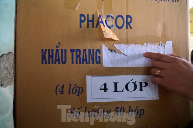 Tạm giữ 500.000 chiếc khẩu trang y tế không rõ nguồn gốc ở Hà Nội - Ảnh 5.