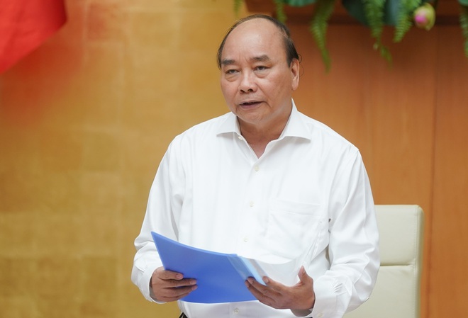 Thủ tướng: Tuyệt đối kh&ocirc;ng để l&agrave;n s&oacute;ng thứ 2 của COVID-19 ở Việt Nam - Ảnh 1.