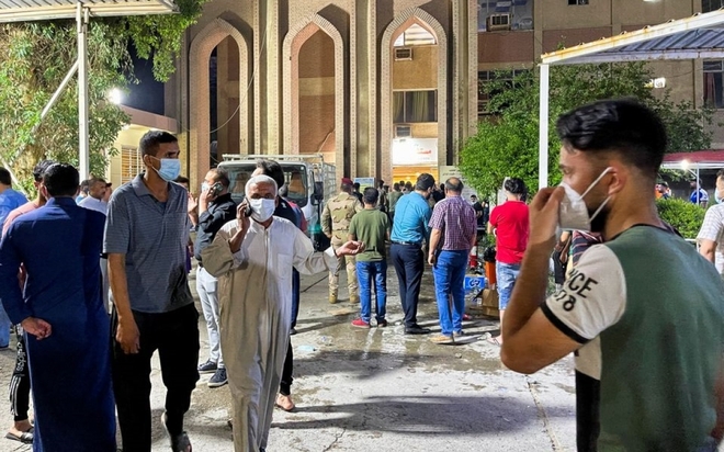 Vụ cháy bệnh viện điều trị Covid-19 ở Baghdad: Do nổ bình oxy - Ảnh 1.