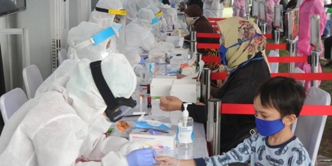Indonesia tăng tốc tiêm vaccine bảo vệ trẻ em trước đại dịch Covid-19 - Ảnh 1.