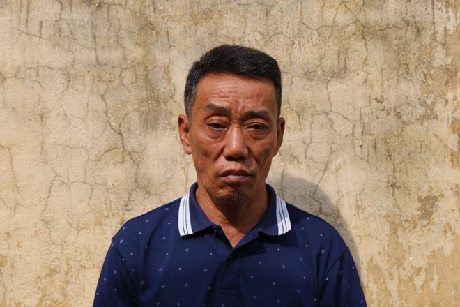 Bắt đối tượng dùng súng cố thủ trong nhà, tẩm xăng lên người dọa giết vợ - Ảnh 1.